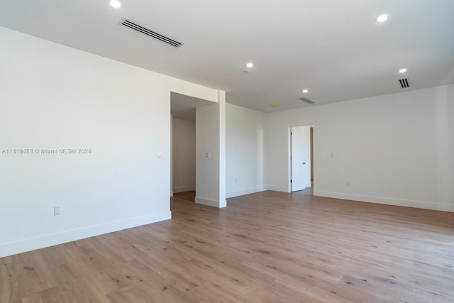 spare room with light hardwood / wood-style floors