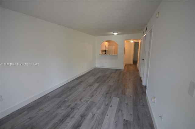 spare room with wood-type flooring