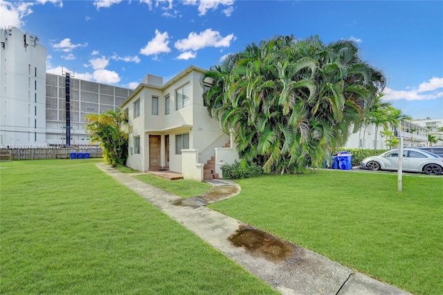 view of front facade featuring a front yard