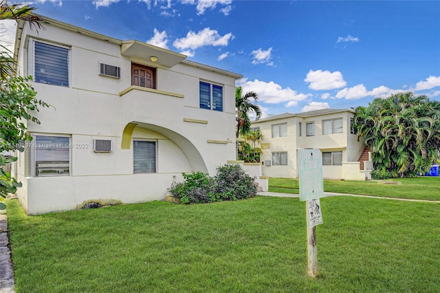 view of front of home with a front lawn