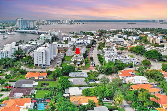 aerial view at dusk with a water view