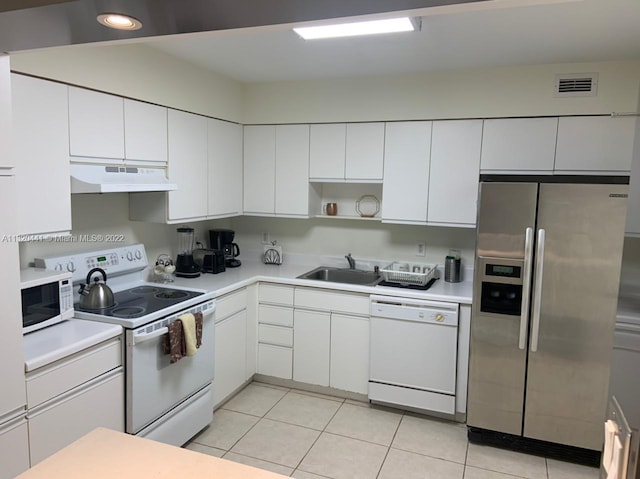 kitchen with sink, white appliances, custom exhaust hood, and white cabinetry