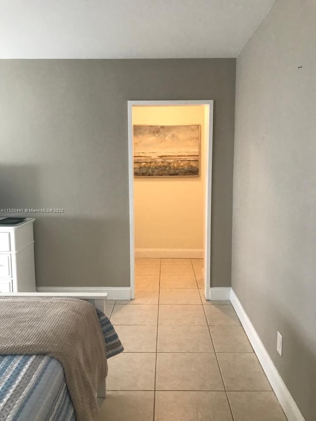 bedroom with light tile floors