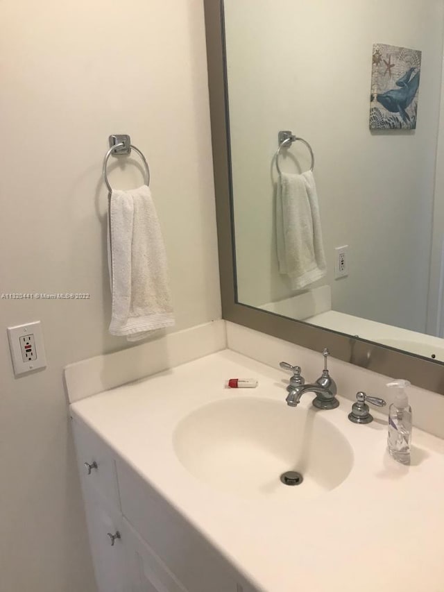 bathroom with vanity with extensive cabinet space