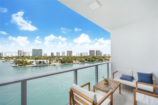 balcony featuring an outdoor hangout area and a water view