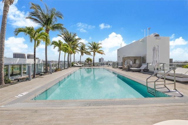 view of swimming pool featuring a patio area