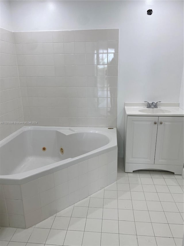 bathroom featuring tile flooring and vanity