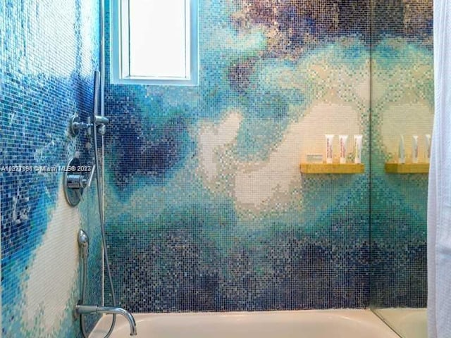 bathroom with tiled shower