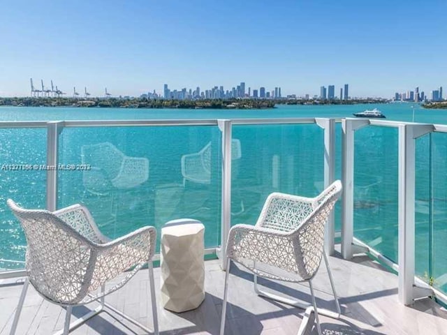 balcony featuring a water view