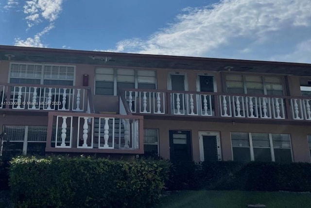 rear view of house with a balcony