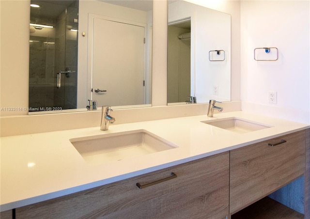 16385 Biscayne Blvd Unit 2016, North Miami Beach, FL 33160 - bathroom featuring double sink vanity and an enclosed shower