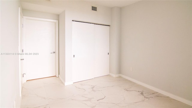 16385 Biscayne Blvd Unit 2016, North Miami Beach, FL 33160 - unfurnished bedroom featuring a closet and light tile floors