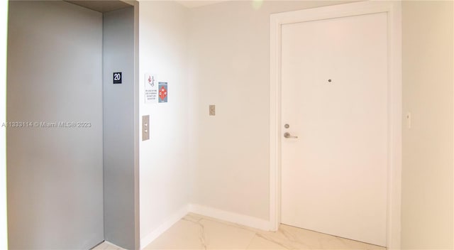 16385 Biscayne Blvd Unit 2016, North Miami Beach, FL 33160 - corridor featuring light tile floors and elevator