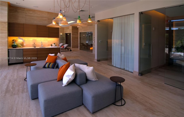 16385 Biscayne Blvd Unit 2016, North Miami Beach, FL 33160 - living room featuring an inviting chandelier, sink, and light hardwood / wood-style flooring