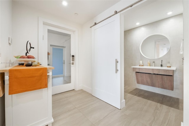 bathroom with tile flooring and vanity