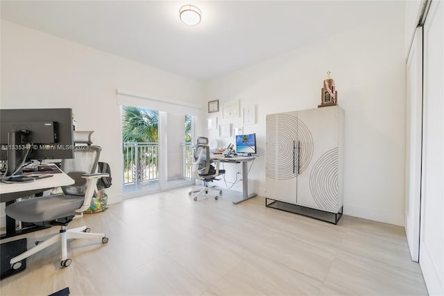 office space featuring light tile floors