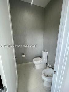 bathroom featuring toilet