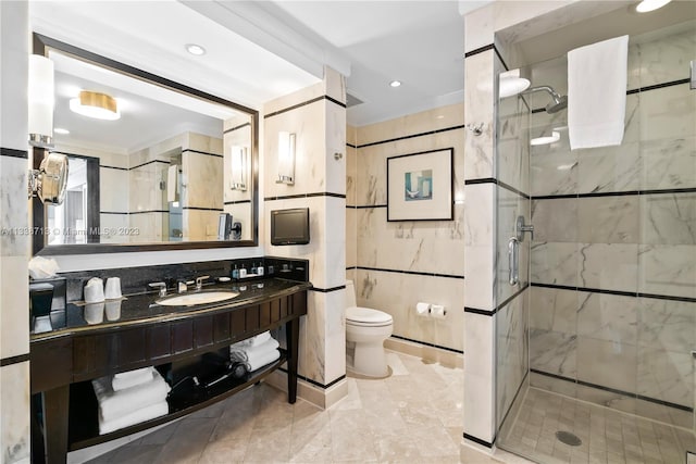 bathroom featuring toilet, tile floors, a shower with shower door, and vanity