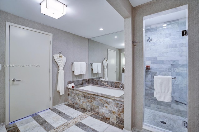 bathroom with tile floors and separate shower and tub