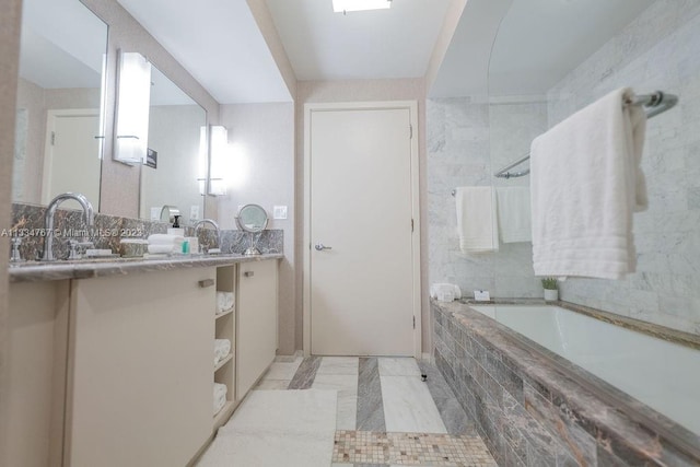 bathroom featuring tile walls, tile flooring, and vanity