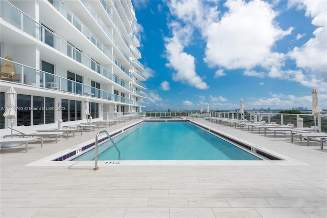 view of swimming pool with a patio area