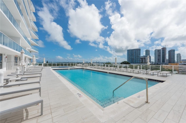 view of swimming pool with a patio area