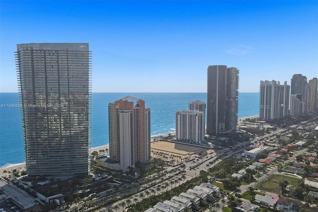 city view featuring a view of the beach and a water view