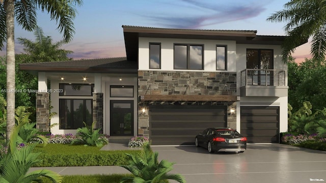 modern home featuring a balcony and a garage