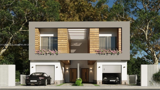 modern home with a balcony, central AC, and a garage