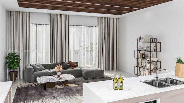 living room with wooden ceiling and sink