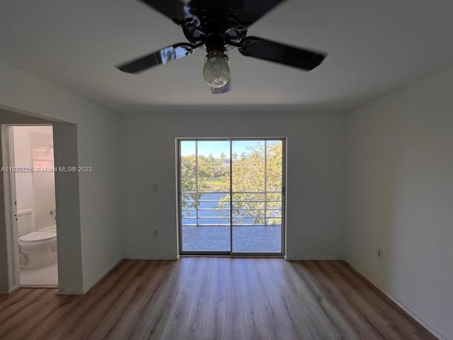 spare room with ceiling fan and light hardwood / wood-style flooring