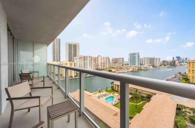 balcony featuring a water view