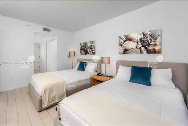 bedroom with light wood-type flooring