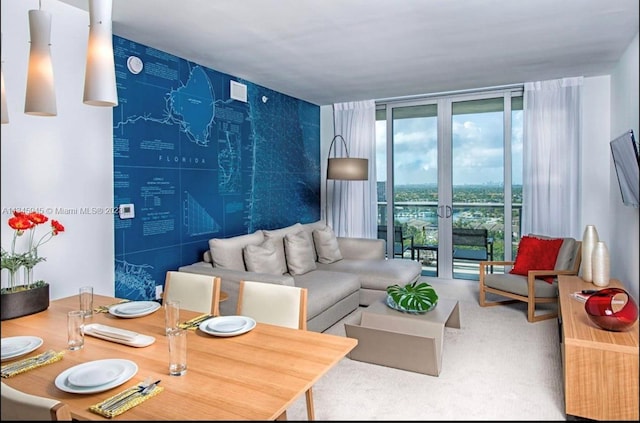 carpeted living room featuring floor to ceiling windows and french doors