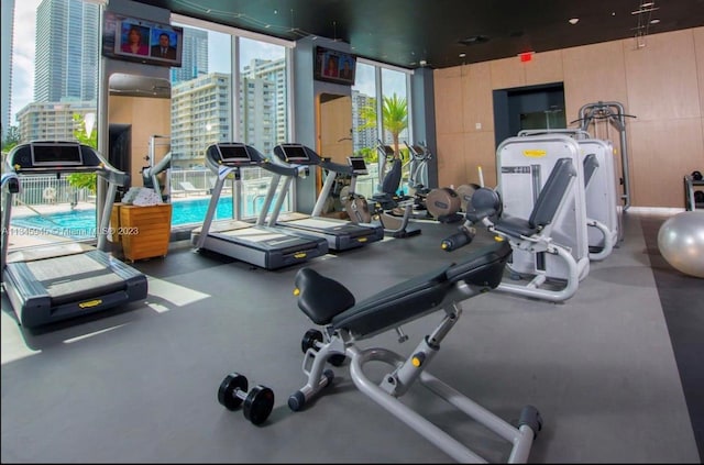 exercise room with floor to ceiling windows