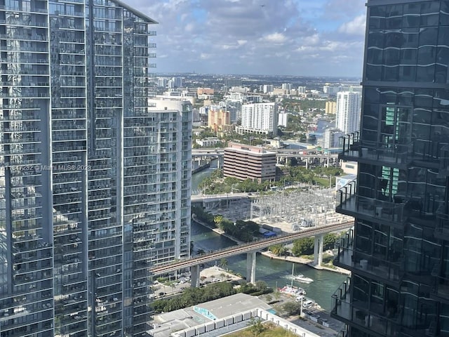 property's view of city featuring a water view