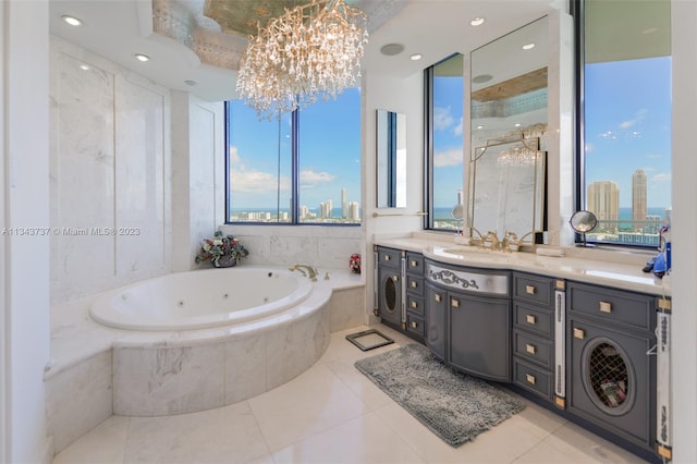 bathroom with a relaxing tiled bath, tile floors, oversized vanity, and an inviting chandelier