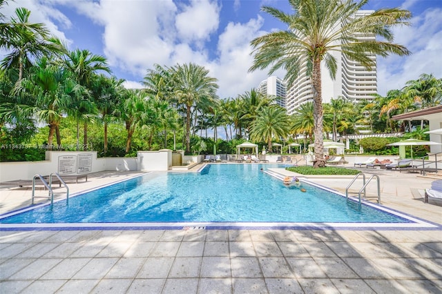 view of swimming pool with a patio area