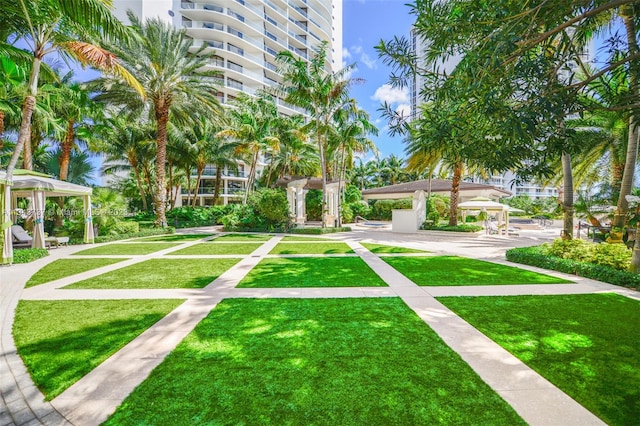 surrounding community featuring a gazebo and a yard