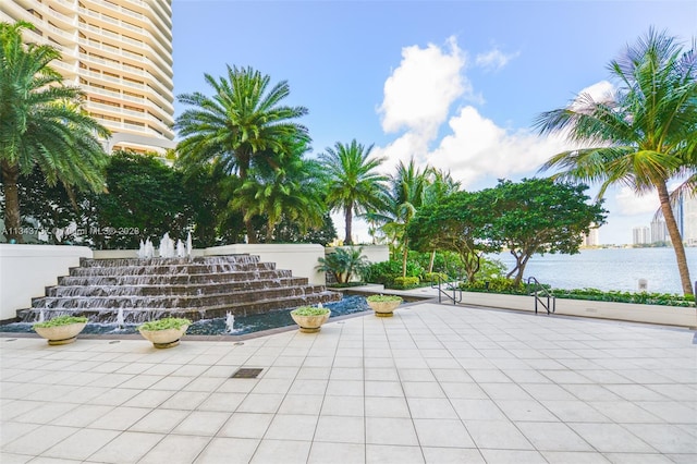 view of patio with a water view