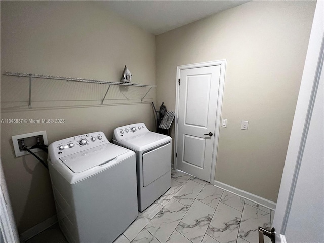 laundry area with washing machine and dryer