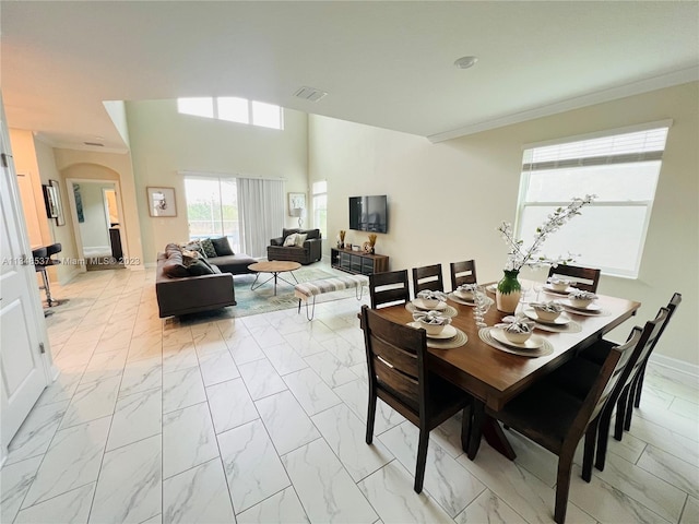 dining area with crown molding