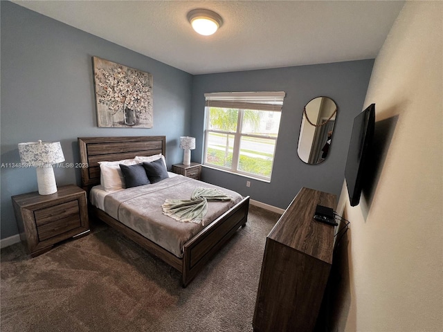 bedroom featuring dark colored carpet