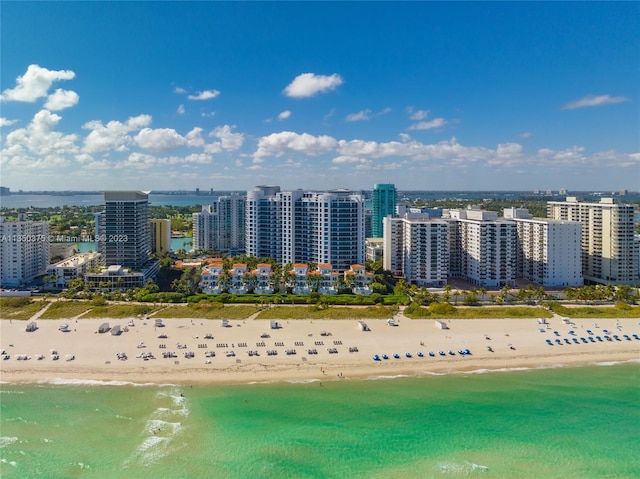 bird's eye view with a beach view and a water view