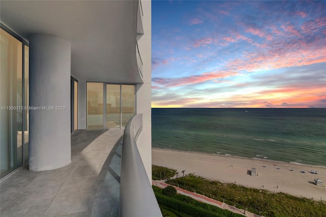 balcony at dusk with a water view