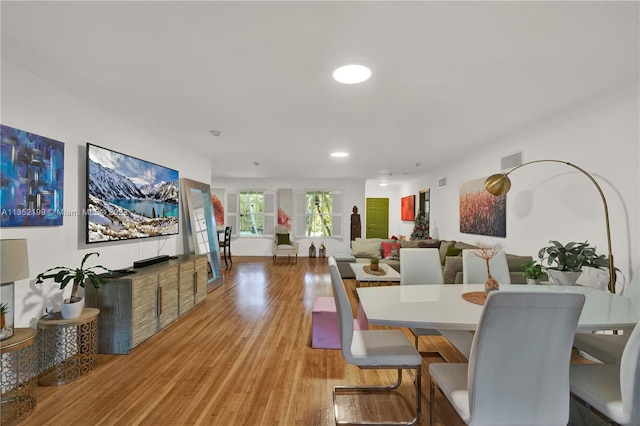 dining area with light hardwood / wood-style floors