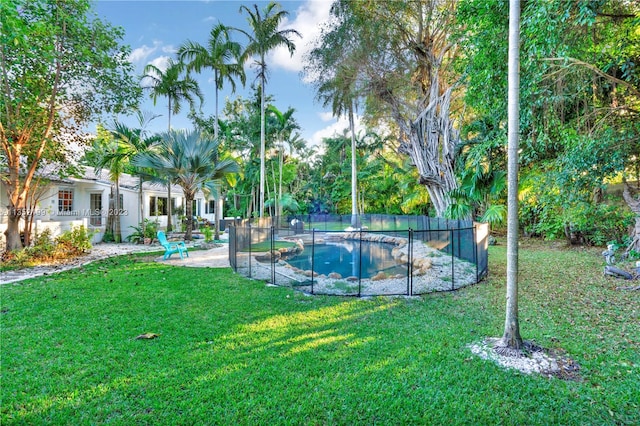 surrounding community featuring a swimming pool, a lawn, and a patio