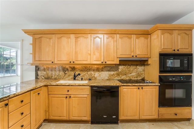 kitchen with light stone countertops, backsplash, black appliances, light tile flooring, and sink