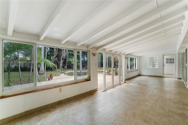 unfurnished sunroom with vaulted ceiling with beams