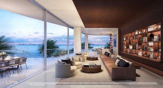 living room with a water view, expansive windows, and light tile floors